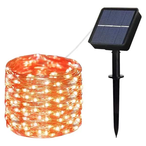 Novogodišnje solarne lampice narandžaste 10 metara u dvorištu